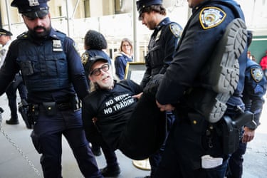 police carry a detained man