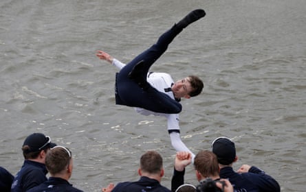 Oxford cox Jack Tottem is thrown into the river by his team-mates as they celebrate victory after the 167th Oxford v Cambridge University Men’s Boat Race on the River Thames near Chiswick Bridge on April 3rd 2022 in London.