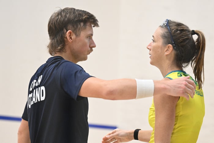 Greg Lobban of Scotland hugs Donna Lobban of Australia during their mixed doubles quarter-final.