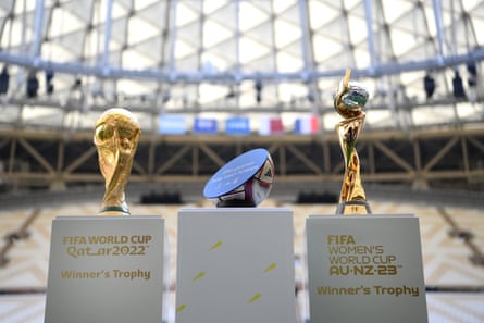 The men's and women's World Cup trophies on display at Lusail Stadium