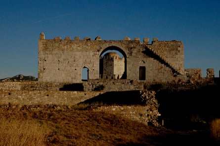 An imposing stone fortress under a blue sky