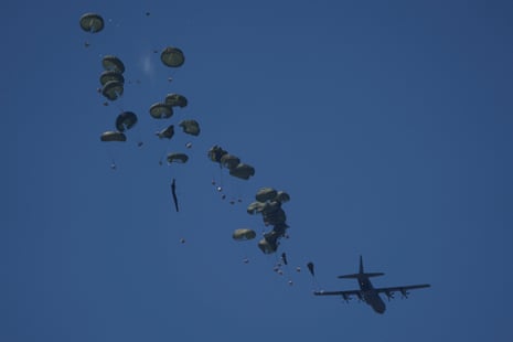 An aircraft airdrops humanitarian aid over Nuseirat, in the central Gaza Strip, Wednesday, Aug. 20, 2025.