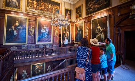 A family looking at artworks in Drumlanrig Castle