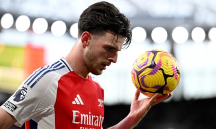 Declan Rice of Arsenal holds a football in one hand.