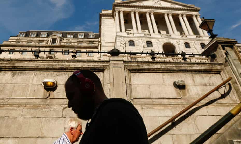 Pedestrians pass on a set of stairs outside the Bank of England