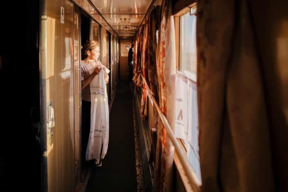 Woman in train corridor
