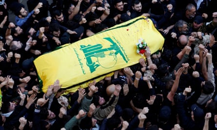 People carry the coffin of a senior Hezbollah figure.