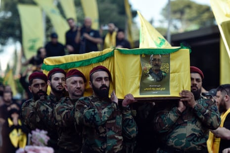 Hezbollah fighters carry the coffin of late Hezbollah commander Ahmad Jawad Shahimi (Abu Hussein), one of six fighters that were killed by an Israeli strike in the Syrian province of Aleppo, during a funeral procession in southern Beirut, Lebanon.