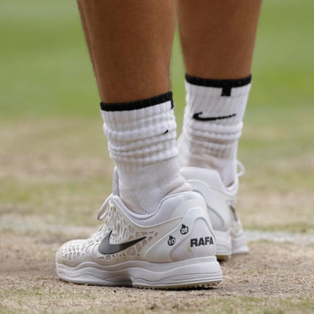 Rafael Nadal’s shoes display the two times he has won Wimbledon in his match.