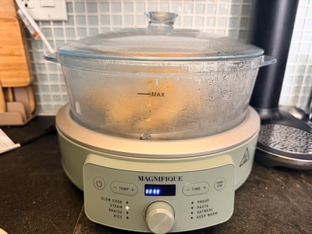 combo air fryer device cooking food on kitchen counter
