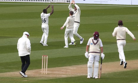 Kemar Roach of Surrey celebrates taking the wicket of Somerset's Kasey Aldridge.