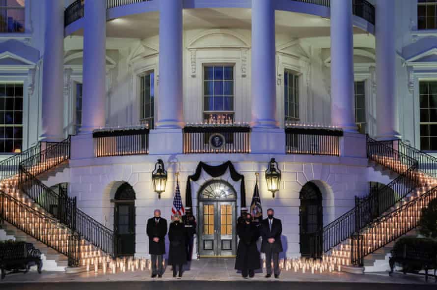 Joe Biden, Jill Biden, Kamala Harris and Doug Emhoff attend a moment of silence and candle lighting ceremony at the White House.