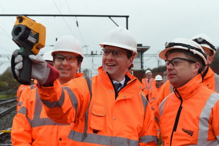 The then chancellor George Osborne uses a thermal-imaging gun during a visit to the site in Crewe to which HS2 trains will run, in November 2015.