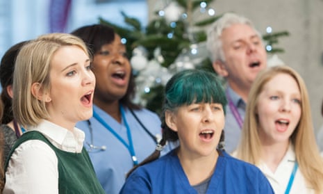 The Lewisham and Greenwich NHS Choir perform their song A Bridge Over You at the QEII Centre in London.