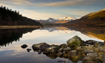 Snowdon from Llyn MymbyrView of Snowdon Horseshoe with Llyn Mymbyr reflection on water in Snowdonia on winter morning.