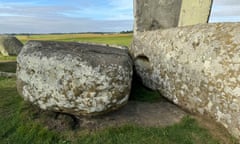 The Stonhenge altar stone lies flush with the ground, hidden beneath two fallen sarsen stones.