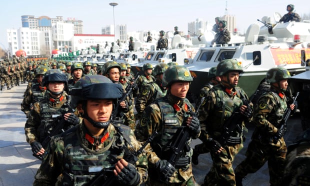 Paramilitary policemen stand in formation as they take part in an anti-terrorism oath-taking rally, in Kashgar, Xinjiang Uighur Autonomous Region, China, in 2017.