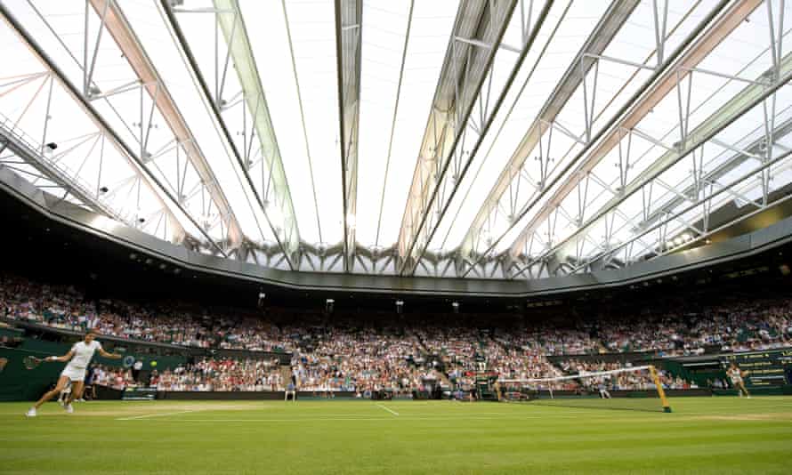 Dinara Safina (left) and Amelie Mauresmo play the first ever point under the Centre Court roof in 2009