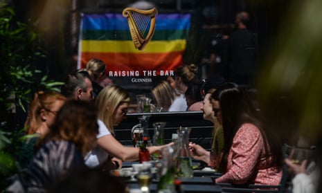 People eating outdoors in Dublin this month. Irish cafes and restaurants were due to resume indoor service on 5 July.