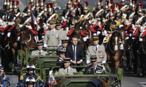 Emmanuel Macron is driven down the Champs Ãlysées
