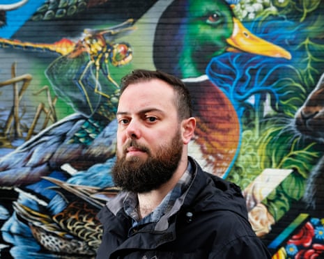 Thomas Swann in Leicester in front of duck mural