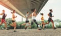 Five runners passing under a bridge.