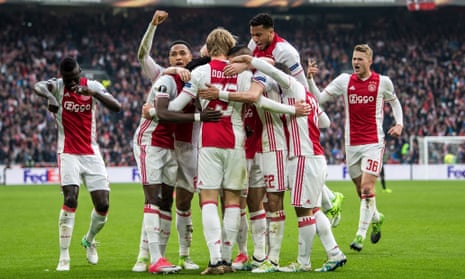 Ajax celebrate their second goal against Lyon in the first leg of the Europa League semi-final.