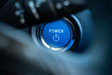 A closeup of a keyless power button for a car