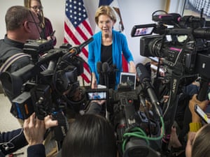 Elizabeth Warrentalks to reporters during a press gaggle after a campaign event in Iowa.