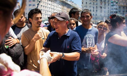 A man gives away choripanes as part of a protest against the ban on food carts near soccer venues in February 2019 in Buenos Aires.