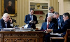 Trump speaks by phone with Vladimir Putin in the Oval Office in January 2017. With him is Reince Priebus, Mike Pence, Steve Bannon, Sean Spicer and Michael Flynn. All except Pence are now out of a job.
