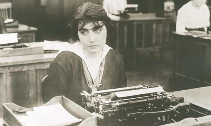 woman typing at desk