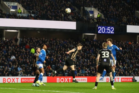Kieran Dowell heads home Rangers’ third goal.