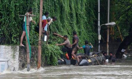 People are rescued from floodwaters in Chennai