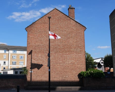 A St George’s cross hangs from a lamp-post