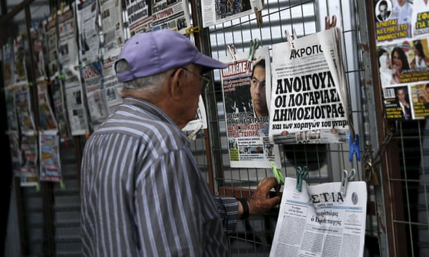 Greek man reading newspaper