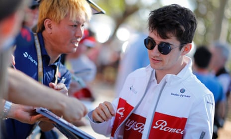 Sauber’s Charles Leclerc signs autographs before the Australian Grand Prix in Melbourne