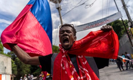  In this file photo taken on October 21, 2022, people protest during a demonstration against Haitian Prime Minister Ariel Henry and the United Nations amid a cholera and security crisis in Port-au-Prince.