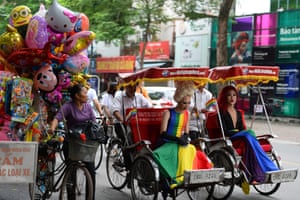 Hanoi, VietnamParticipants ride on traditional three-wheeler rickshaws during a gay pride parade to advocate gay rights