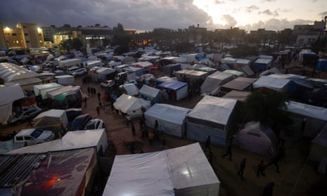 Palestinians displaced by the Israeli bombardment of Gaza are seen in tents in Khan Younis in the south