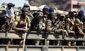 Soldiers patrol the streets of Harare on Thursday. 