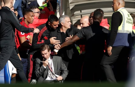 José Mourinho has to be restrained after a late Chelsea equaliser against his Manchester United side in October 2018