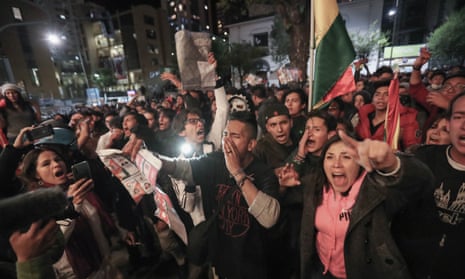 Supporters of the Bolivian opposition candidate Carlos Mesa of Comunidad Ciudadana party prepare to burn ballots during a protest in La Paz, Bolivia on Monday.