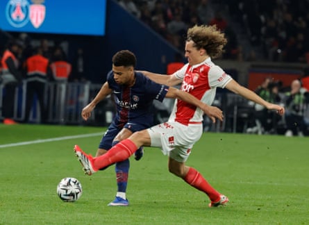 Monac’s Wout Faes tackles Désiré Doué of PSG