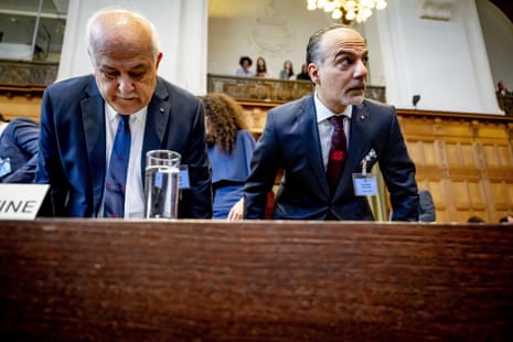 Ammar Hijazi (R) attends day one of the public hearings at the International Court of Justice in The Hague.