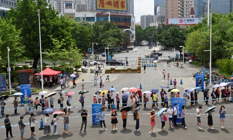 People queue to receive the Covid-19 vaccine in Guangzhou in Guangdong province, China.