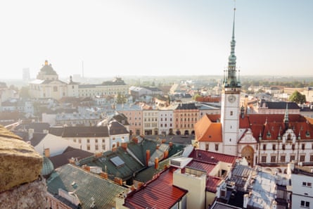 View over city rooftops, spires and residential buildings and monuments.