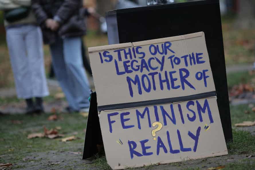 Protests … banners were left against the statue’s plinth.