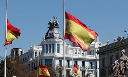 Spanish flags at half mast.