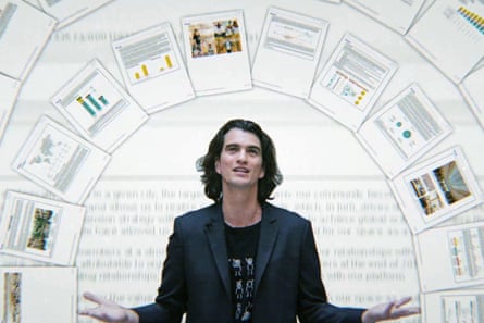 A tech founder wears a T-shirt and blazer while giving a presentation, behind him is a carousel of documents showing data